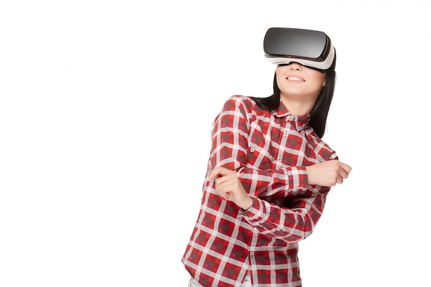 Photo smiling emotionally girl dancing in virtual reality.