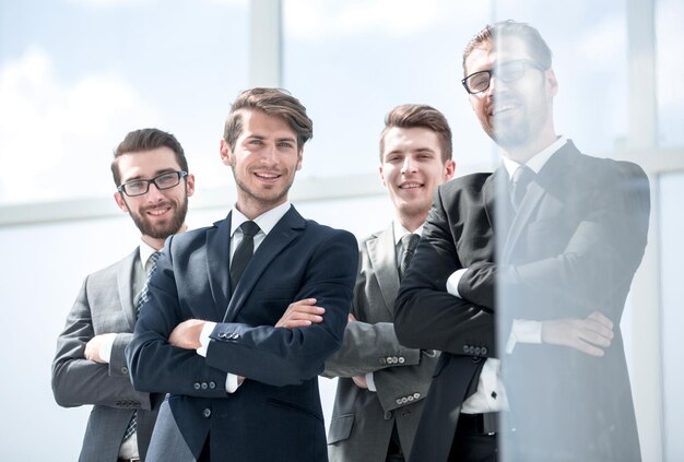 Smiling employees standing togetherphoto with copy space