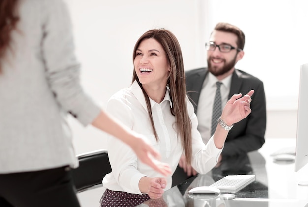 Smiling employees talking in the workplaceoffice weekdays