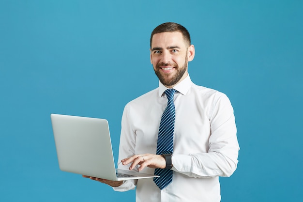 Smiling enterprising manager with laptop