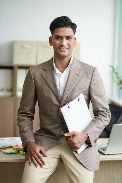 Smiling Entrepreneur with Clipboard