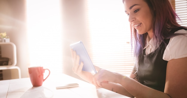 Smiling executive using digital tablet