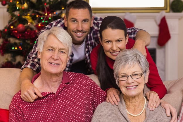 Smiling family posing at christmas 