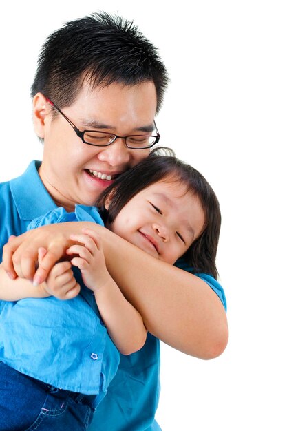 smiling father carrying daughter against white background