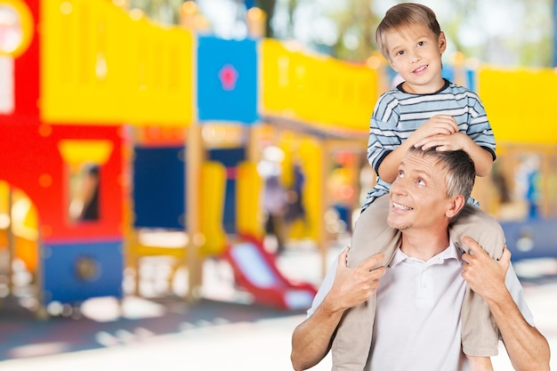 Smiling Father and Son Playing Isolated on White