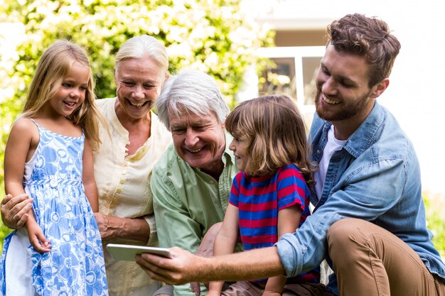 Smiling father taking selfie with family