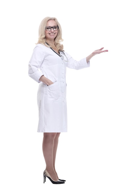 Smiling female doctor pointing at a white blank screen