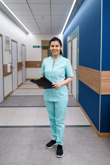 Smiling female doctor poses in clinic