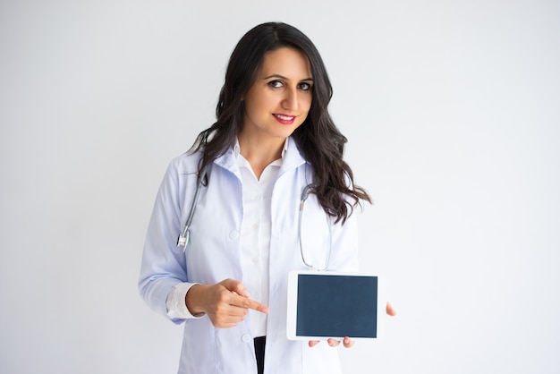 Smiling Female Doctor Showing Tablet Screen