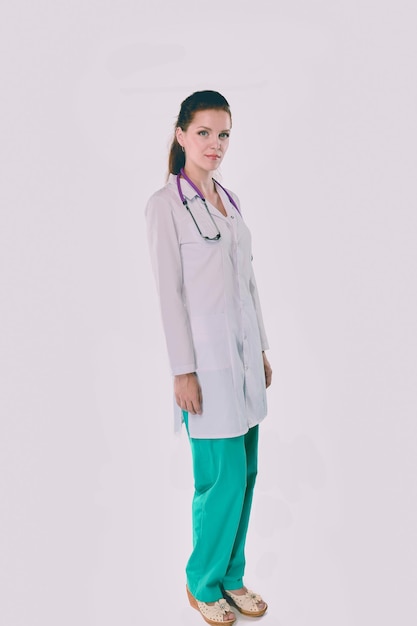 Smiling female doctor with a folder in uniform standing at hospital Smiling female doctor