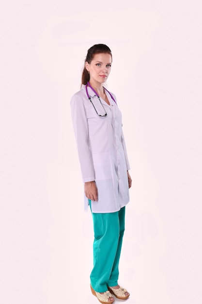 Smiling female doctor with a folder in uniform standing at hospital Smiling female doctor