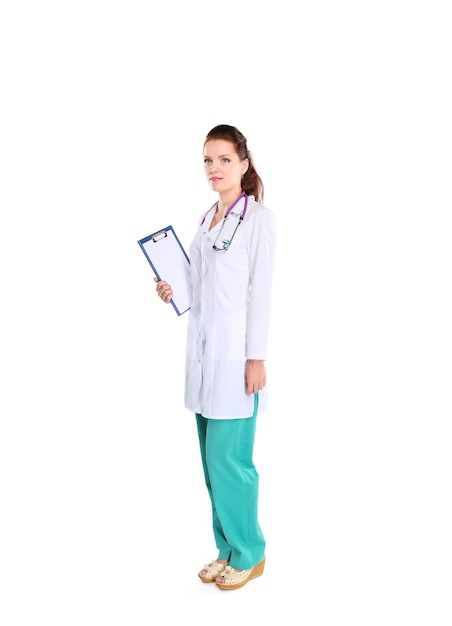 Smiling female doctor with a folder in uniform standing at hospital