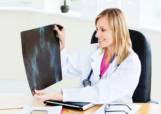 Smiling female looking at X-ray