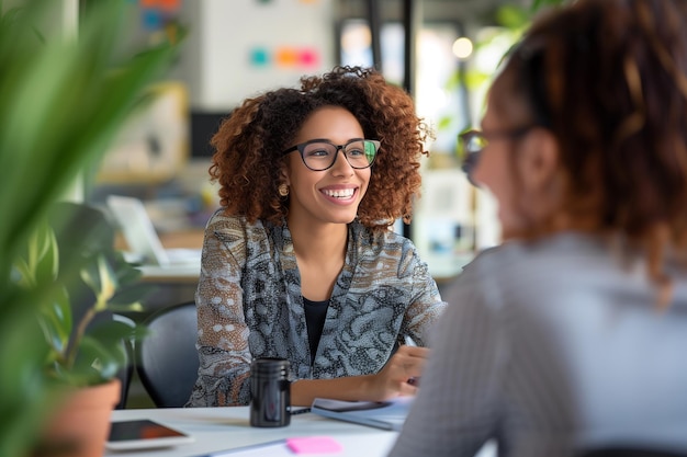 Smiling Female Manager Interviewing an Applicant In Office