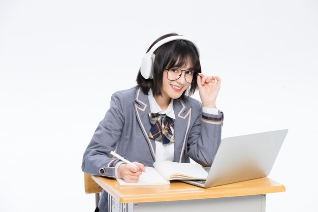 Smiling female student issolated on white background