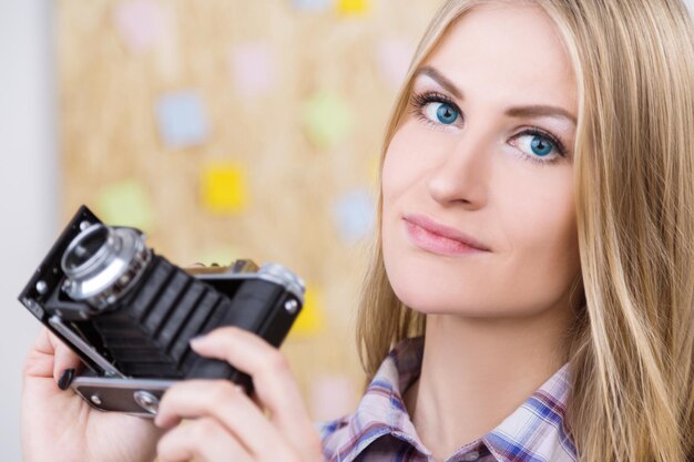 Smiling female with camera