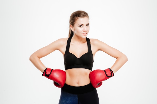 Smiling fitness woman in boxing gloves