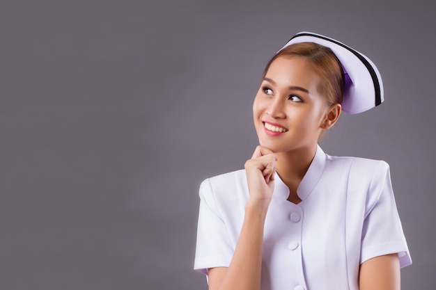 Smiling friendly Asian nurse