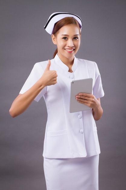 Smiling friendly Asian nurse