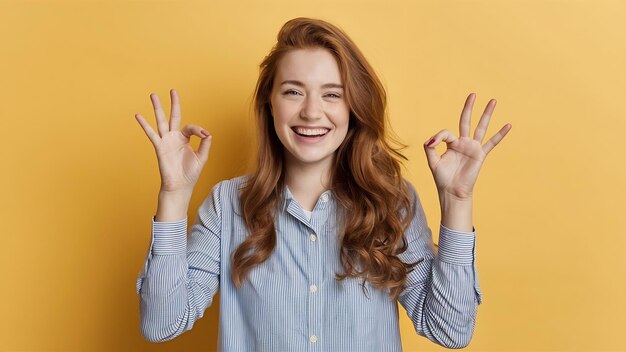 Photo smiling ginger girl laughing showing okay ok signs and look happy approve and say no proble like an