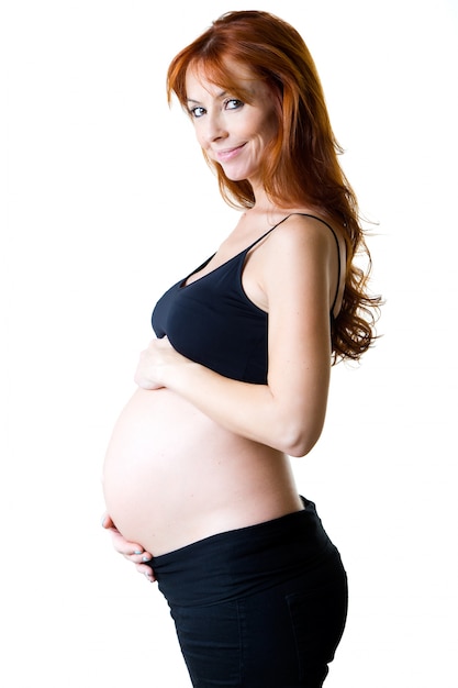 Smiling ginger pregnant woman