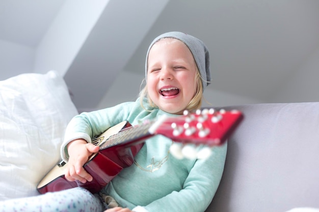 Smiling girl on bed at home