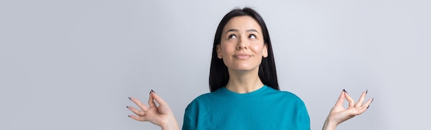 Smiling girl gesturing OK sign with her hand