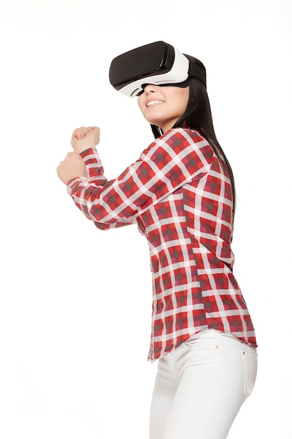 Photo smiling girl playing sports game in virtual reality.