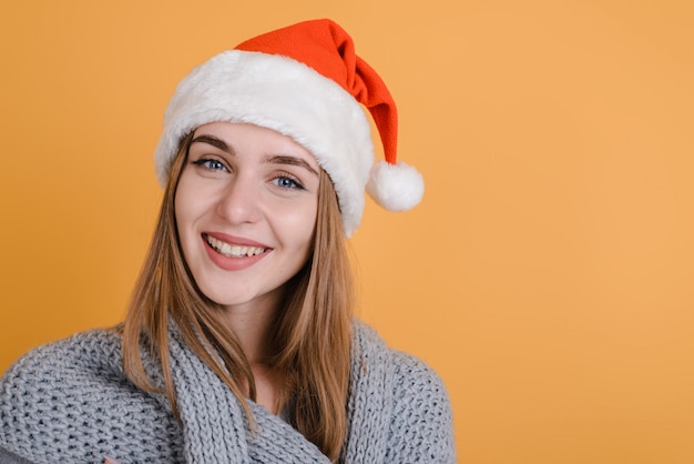 Smiling girl in Santa Claus hat