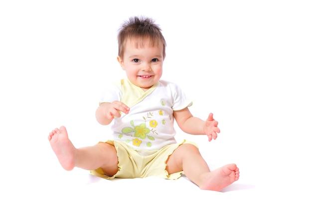 Smiling girl sitting on the floor