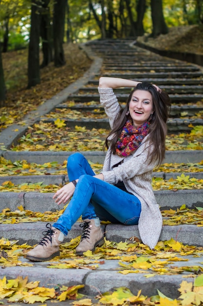 Smiling girl sitting on the stairs