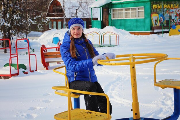 Smiling girl in snow during winter