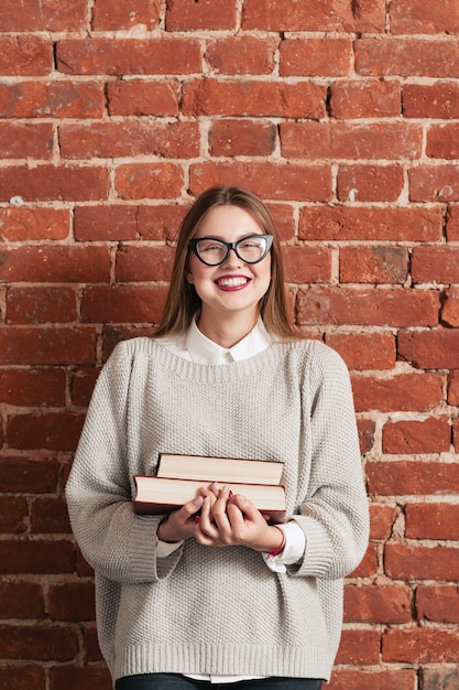 Smiling girl student with books