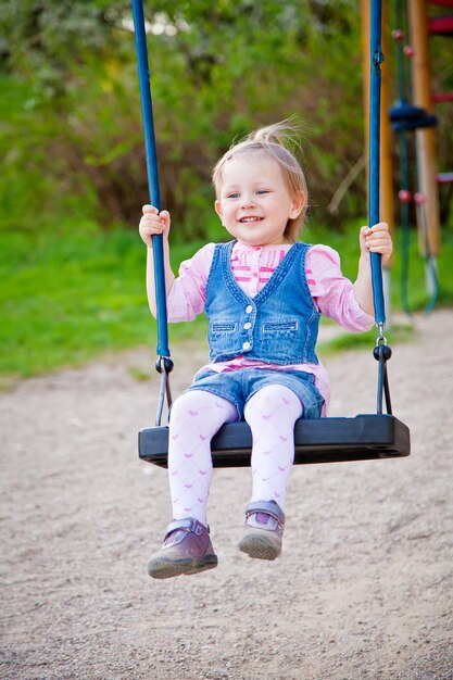 Smiling Girl Swinging