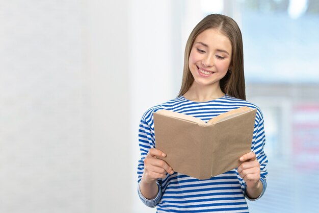 Smiling girl with books