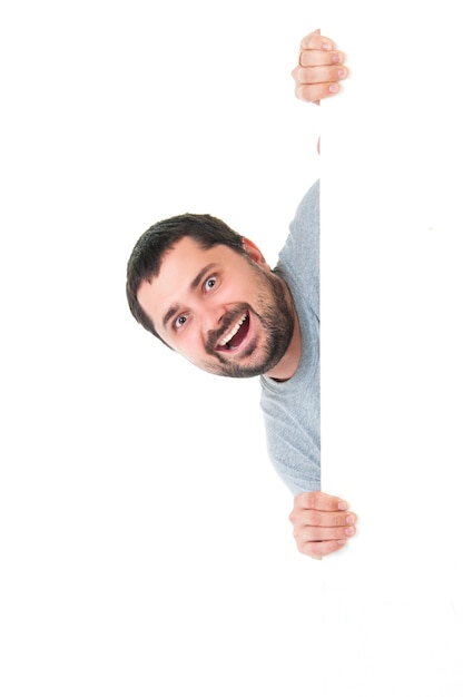 Smiling handsome bearded man wearing a gray blue tshirt 