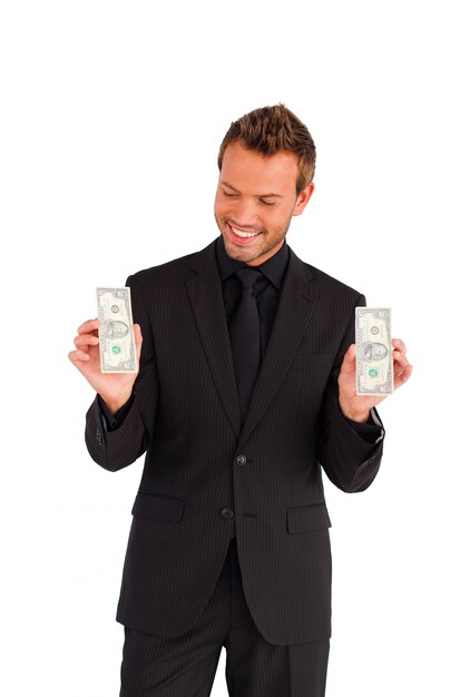 Smiling handsome businessman looking at dollars