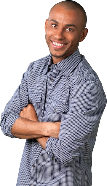 Smiling handsome man with crossed hands isolated on white