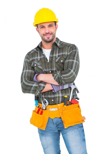 Smiling handyman wearing tool belt 