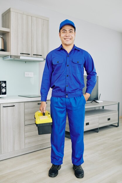 Smiling handyman with toolbox