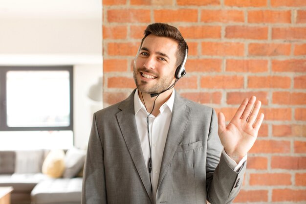 smiling happily and cheerfully, waving hand, welcoming and greeting you, or saying goodbye