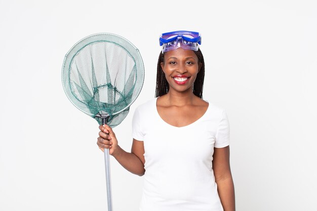 Smiling happily with a hand on hip and confident with goggles and fisher net