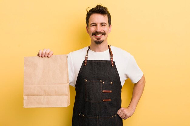 Photo smiling happily with a hand on hip and confident