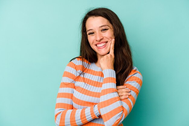 smiling happy and confident touching chin with hand