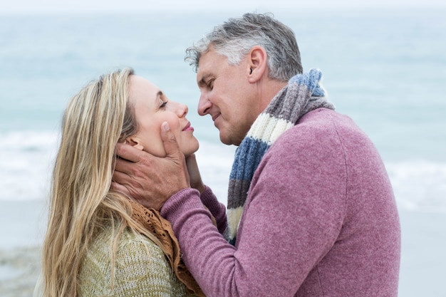 Smiling happy couple about to kiss