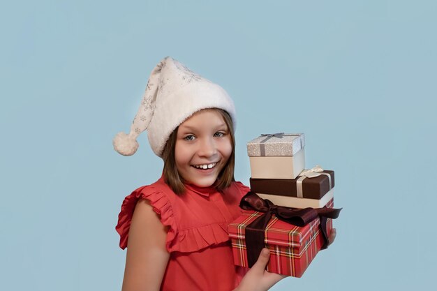 Smiling happy girl with a Christmas gift Holidays and events Christmas