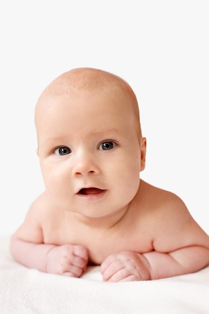 Smiling happy naked baby infant isolated portrait, look at camera