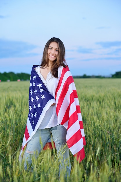 Smiling happy woman with the American flag