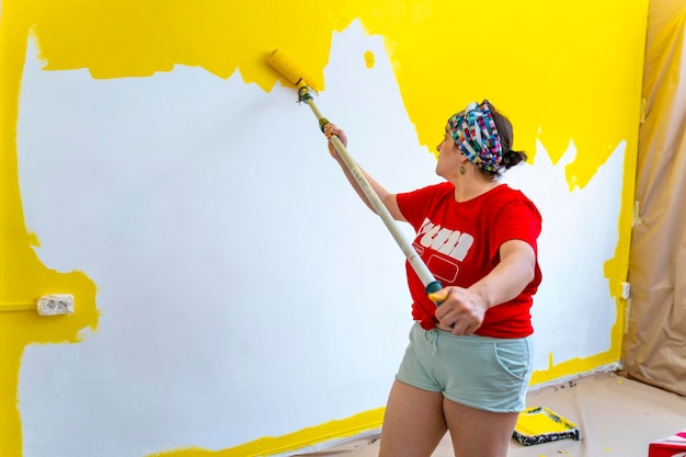 Smiling Home Transformation MiddleAged Woman Painting Walls Yellow