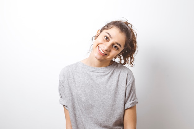 Smiling Indian girl on white background. 